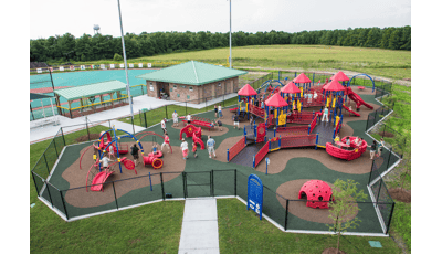 Olsen Park Wilmington, NC features an inclusive playground including a PlayBooster® play structure, accessible ramps, sensory-rich play panels, and many playground climbers and slides. Plus, a Weevos® play structure.